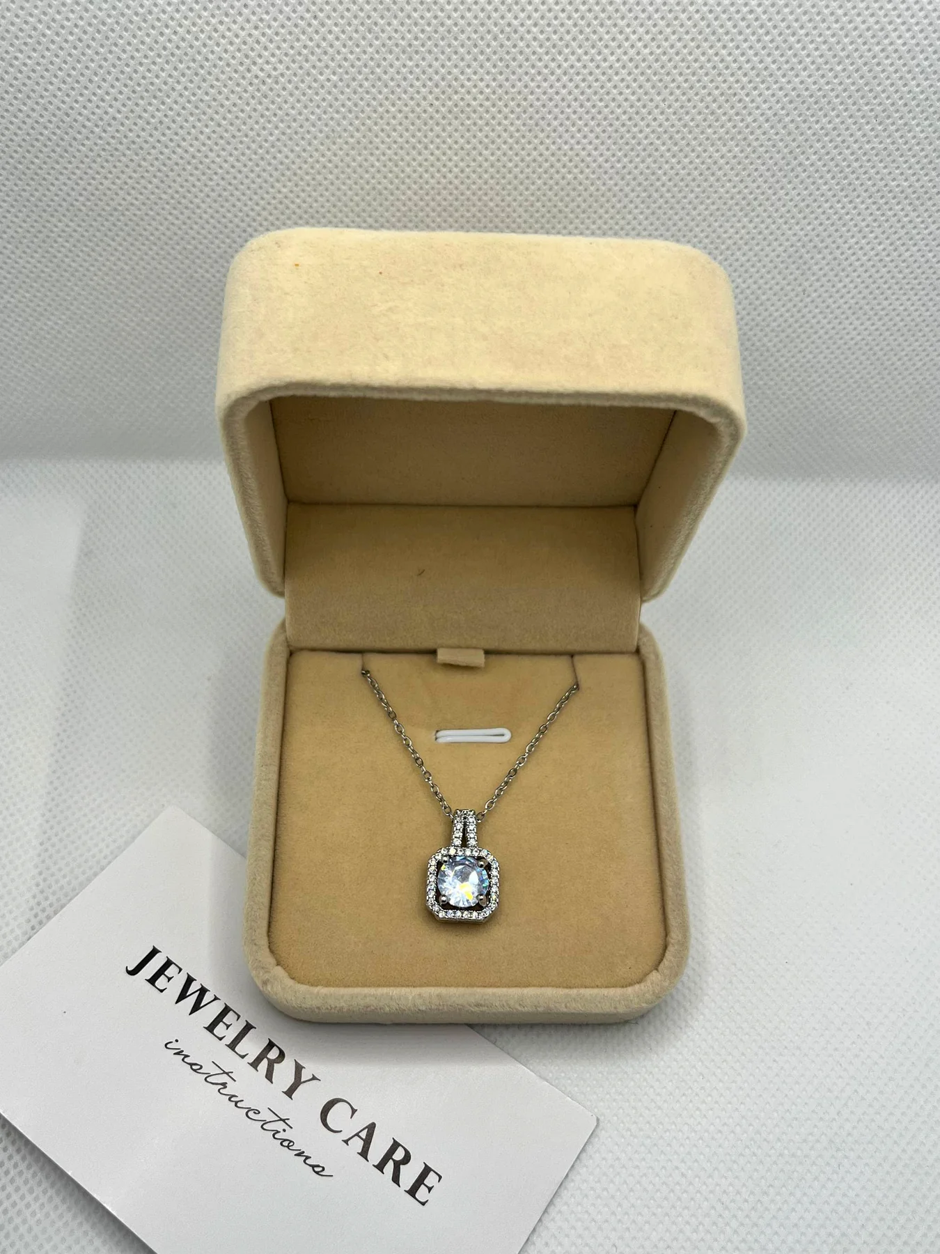 Joura necklace with jewelry care card